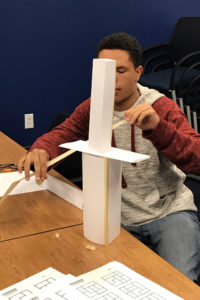 CITY student participating in the building project