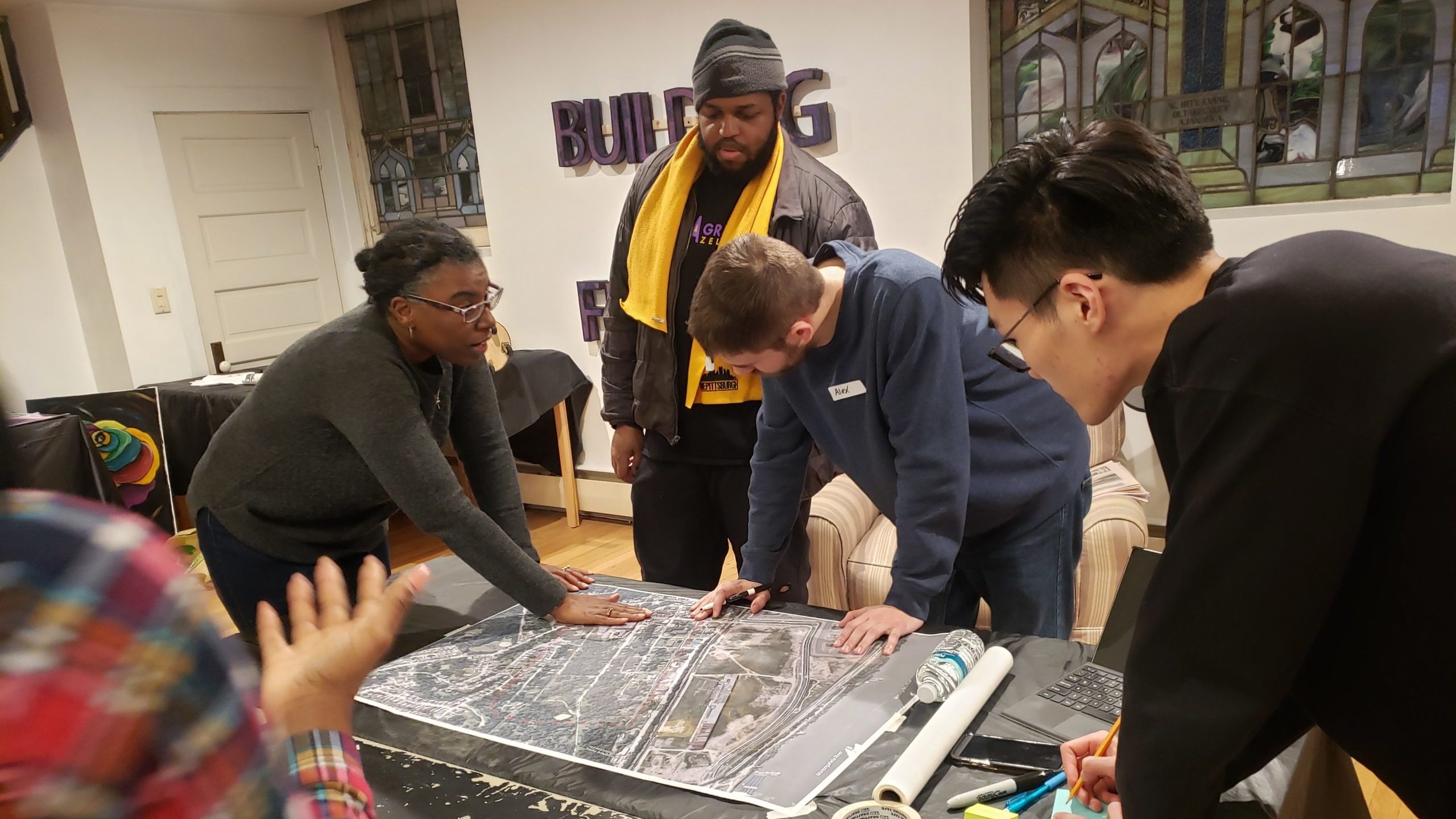 Students look at architectural plans