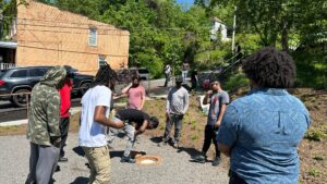 Landforce crew members standing around stormwater infrastructure site