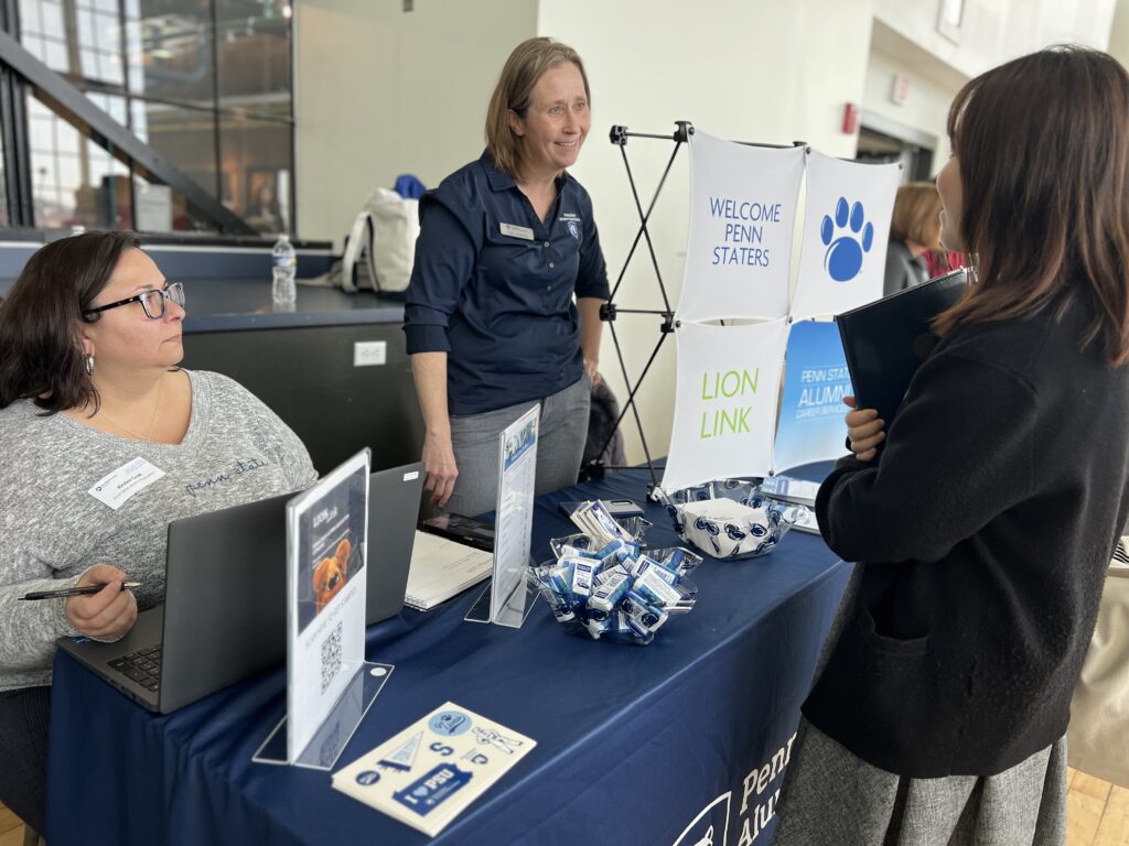 LionLink table representatives talking to student