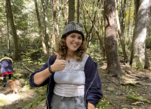 Hannah Kadrie stands in wooded area