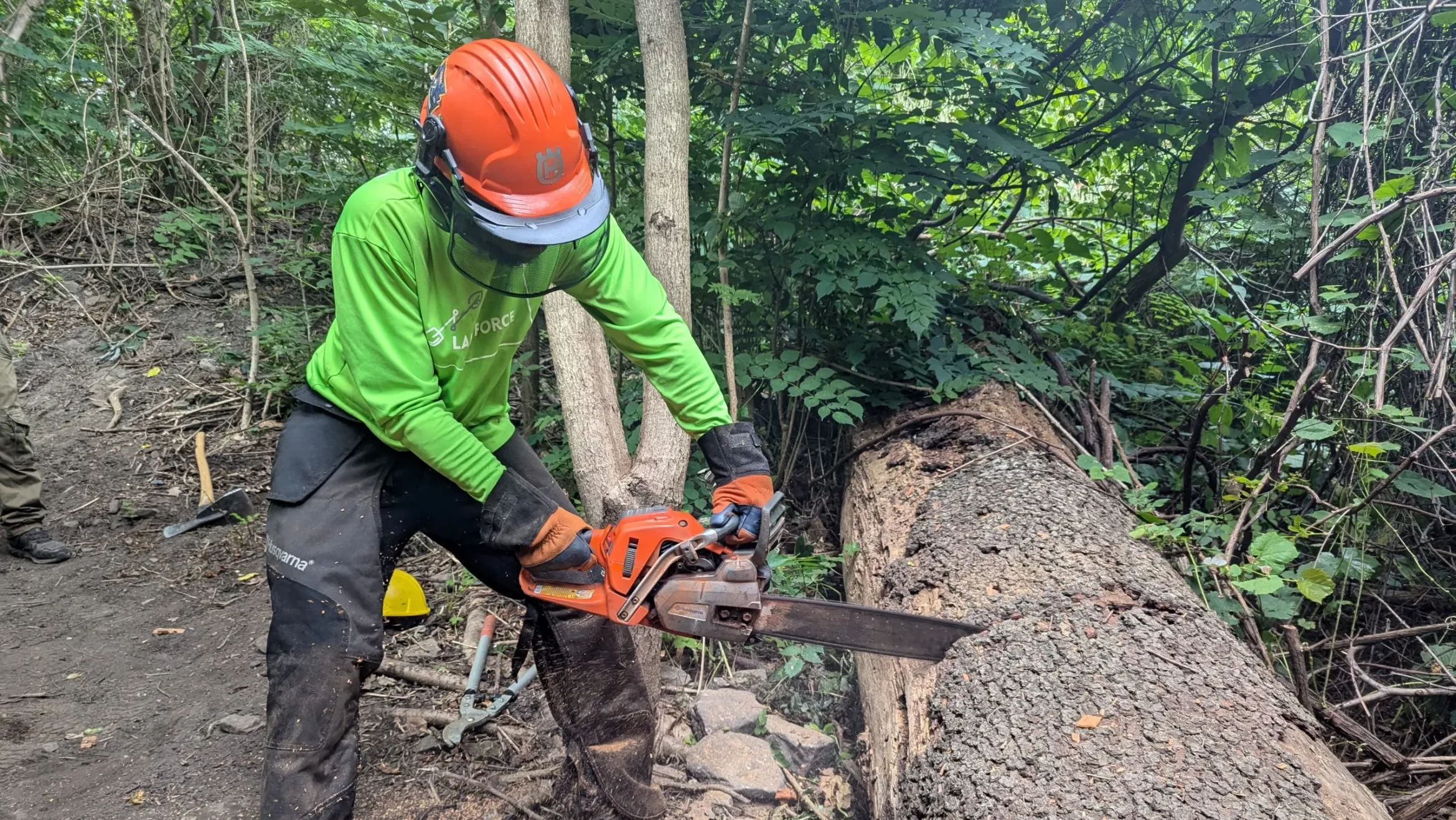 Landforce-crew-member-with-chain-saw